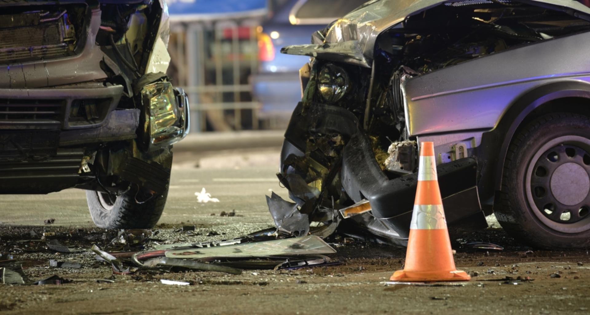 Two damaged vehicles after a head on collision
